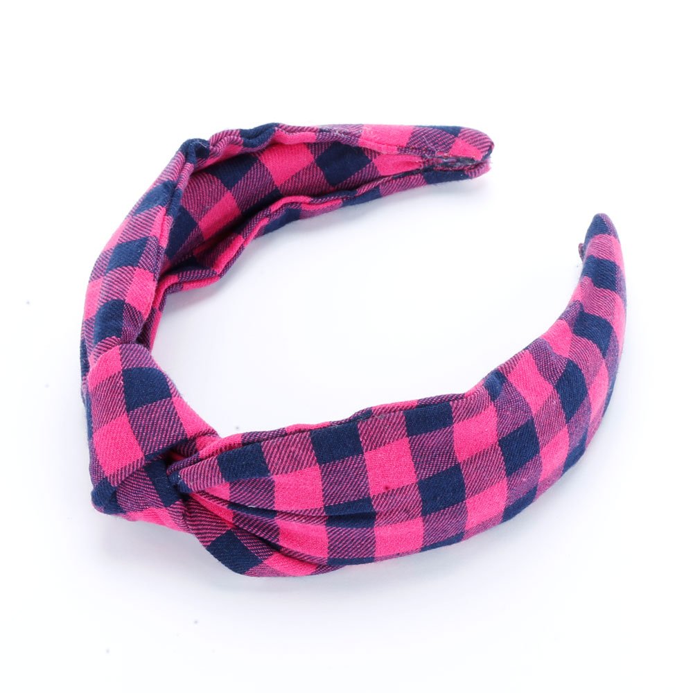 Girls' padded headband in bright pink and navy plaid with a twisted front