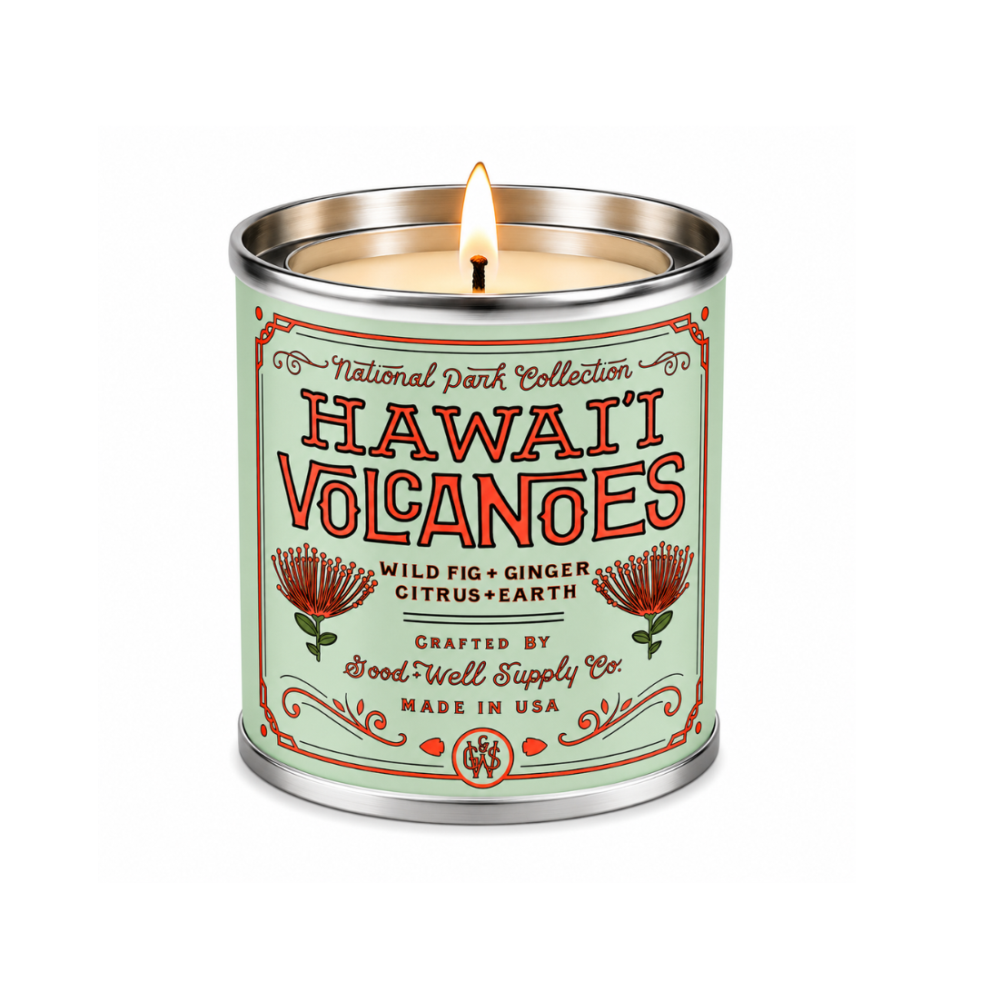 Hawai'i Volcanoes National Park candle in a mint-green tin, lit cotton wick, wild fig and ginger scent