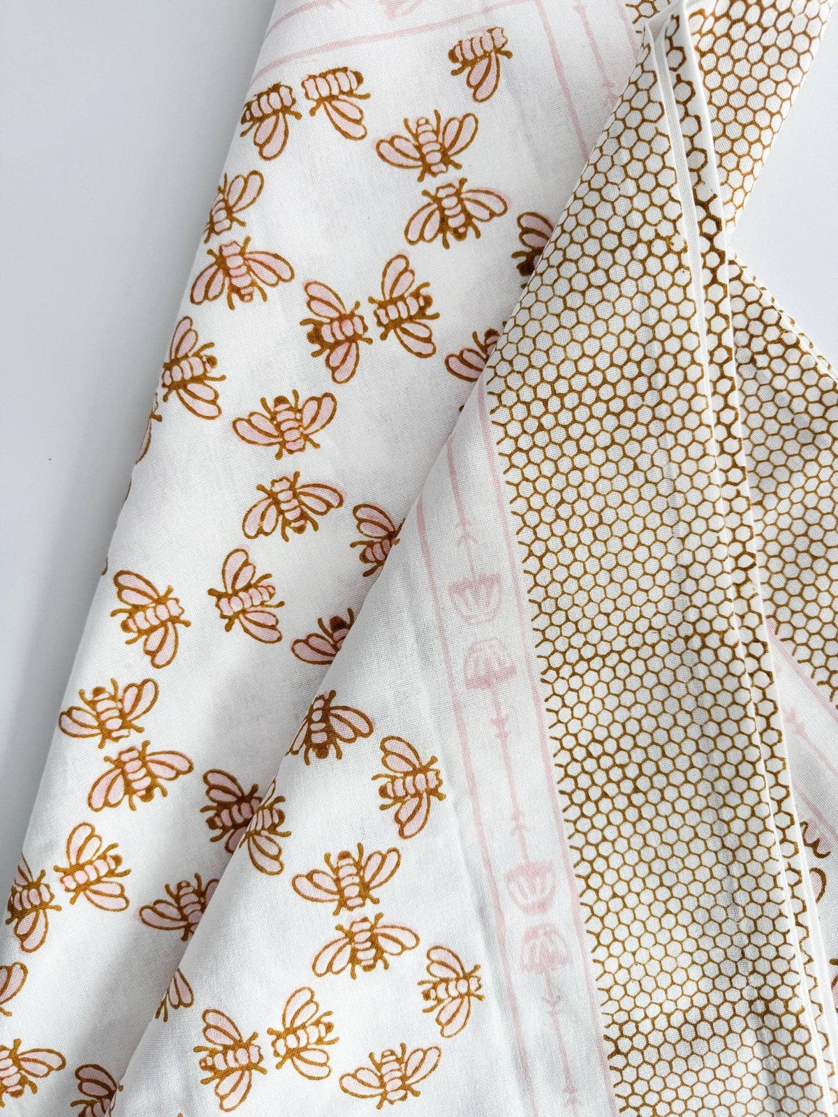 White table throw with honeybee vines and mustard honeycomb pattern band