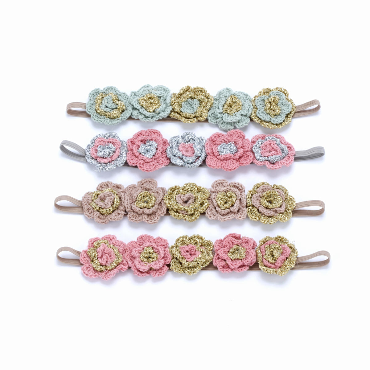 Four knitted flower headbands in blue, pink, taupe, and mixed colors