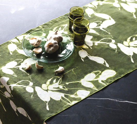 Olive green floral table runner with white botanical print, corner view