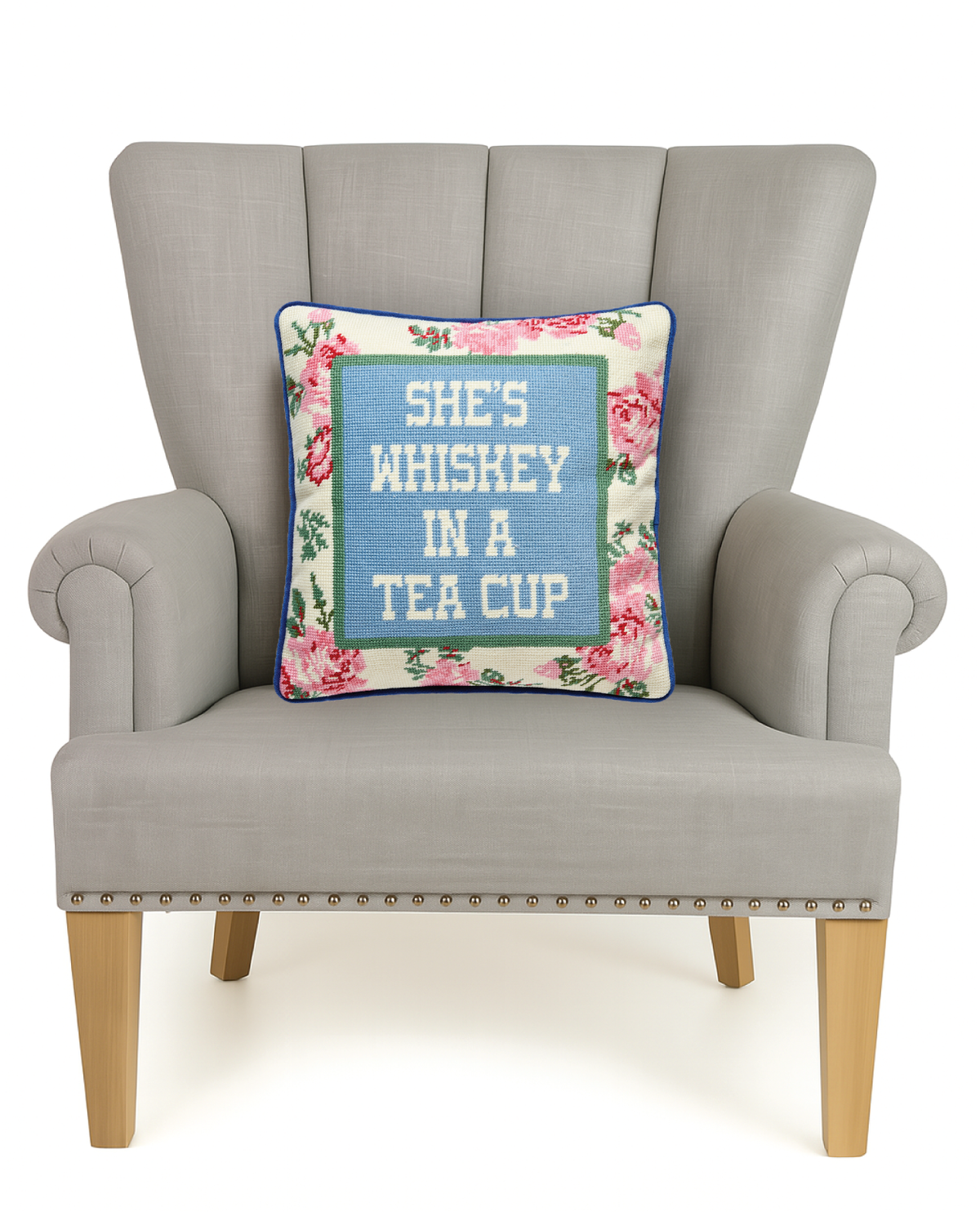 Square floral embroidered accent pillow with blue “She’s Whiskey in a Tea Cup”
