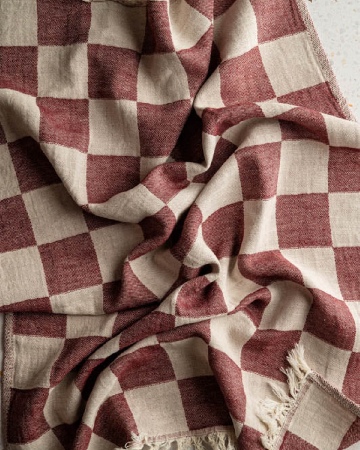 Hand-stitched towel fabric, beige and maroon checkered cloth with fringed trim