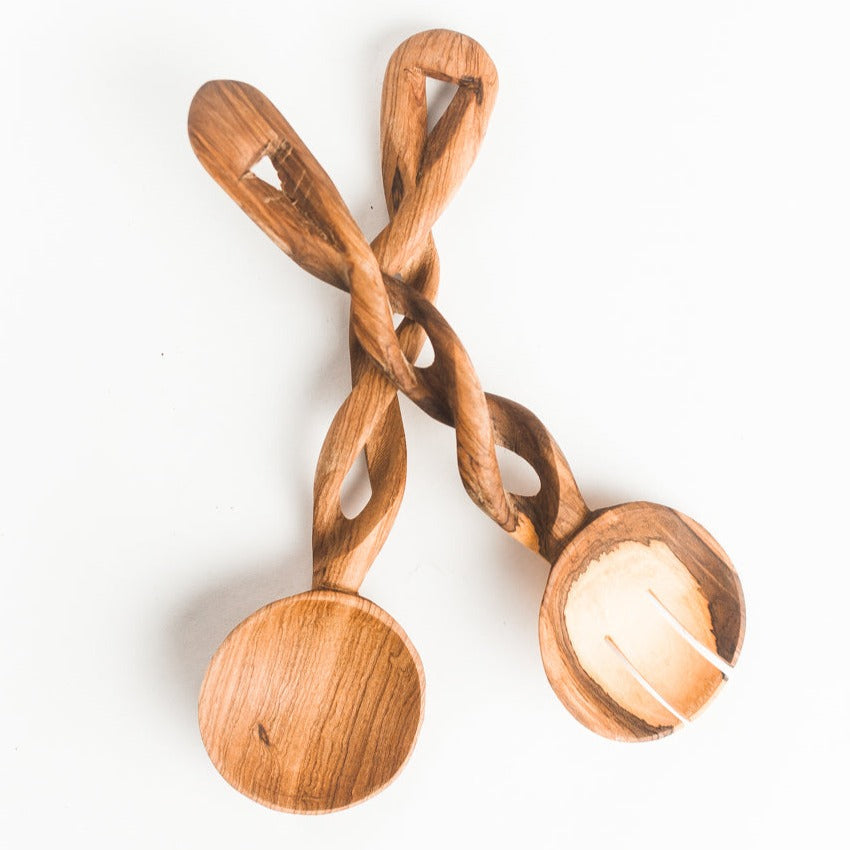 Olive wood spiral serving spoons crossed with round scoops and carved oval cutouts (pair).