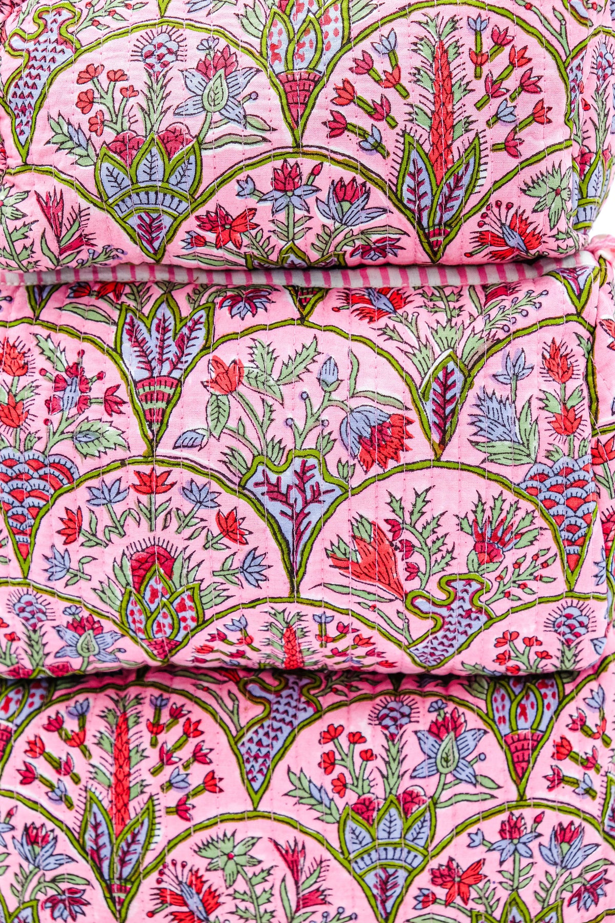Toiletry bag fabric with pink background and colorful botanical arch pattern