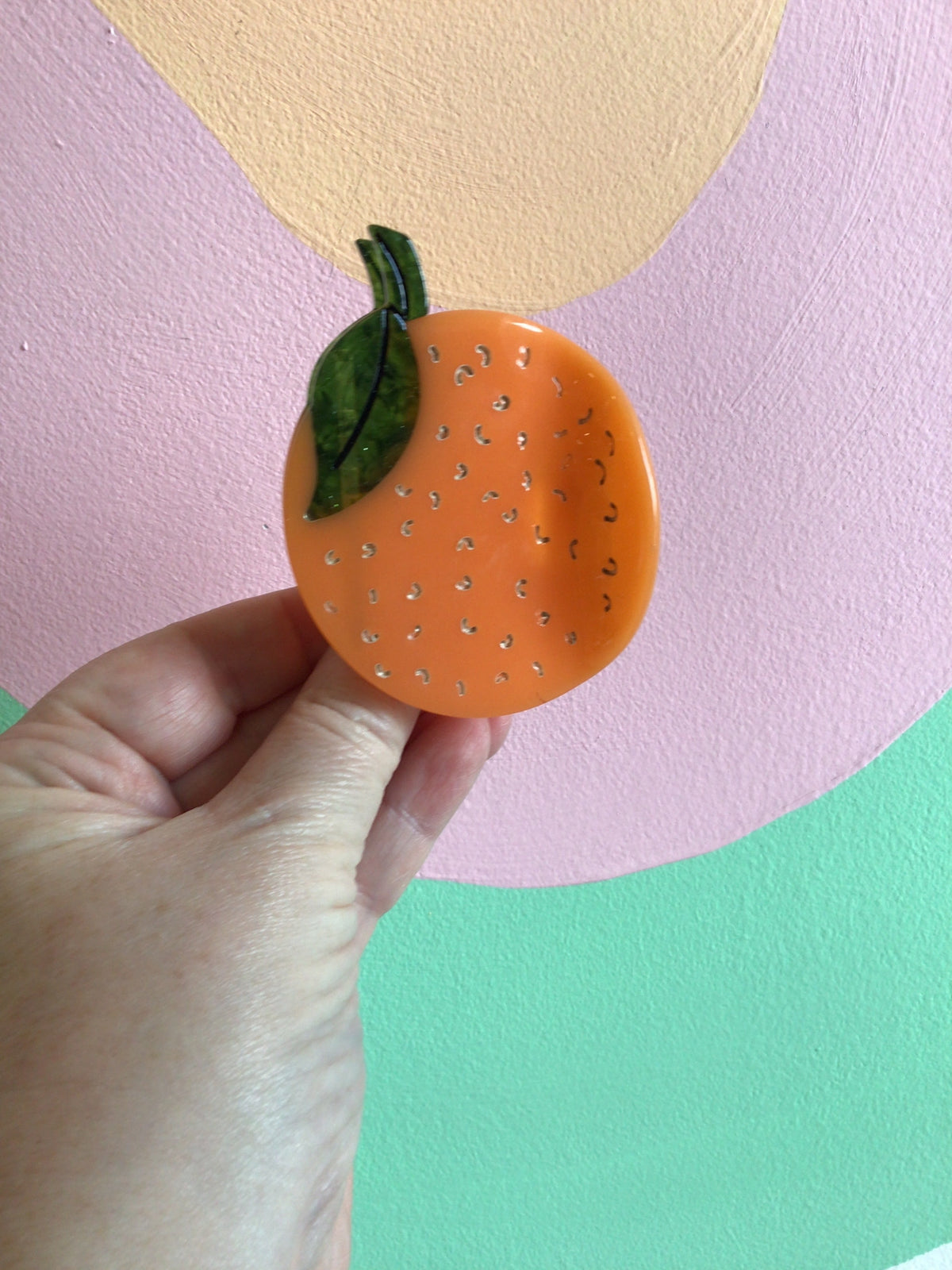 Orange lime food hair claw with green leaf and speckles