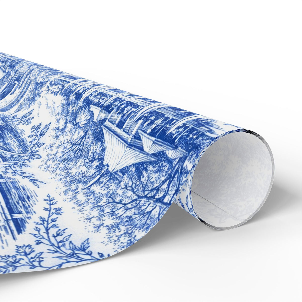 Rolled blue-and-white toile wrapping paper showing end cardboard tube