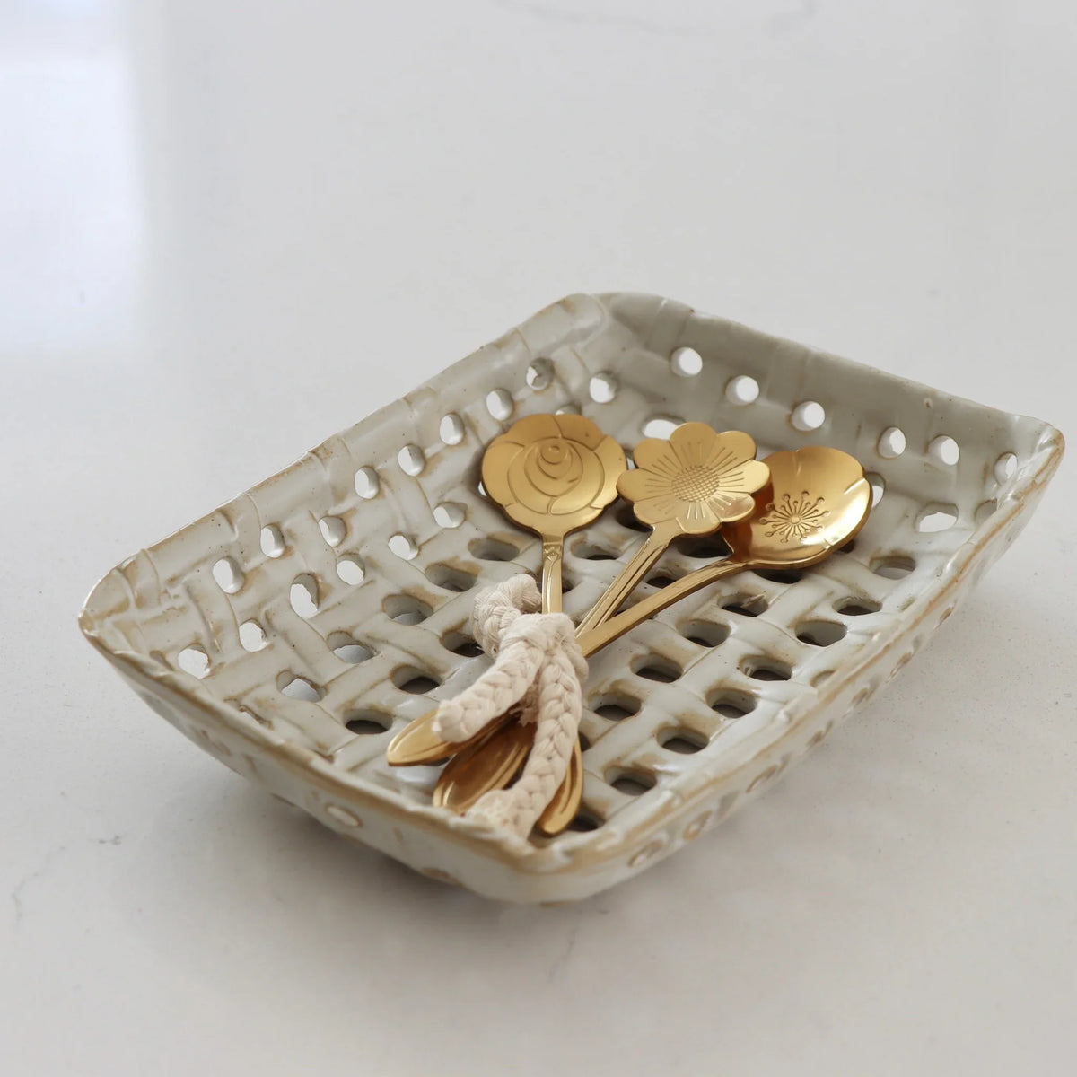 Cream glazed ceramic lattice basket dish with gold decorative coins