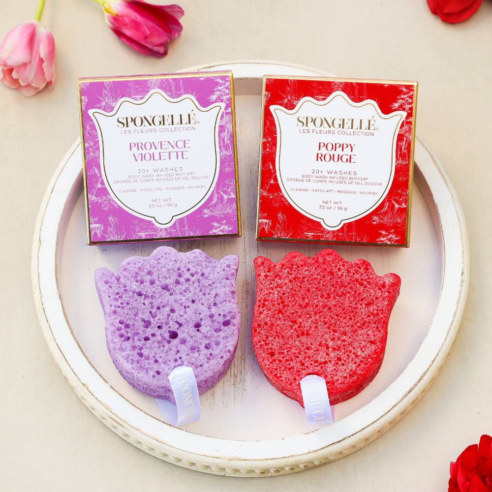 Body buffer set with red and purple sponges and two boxed washes on a tray.