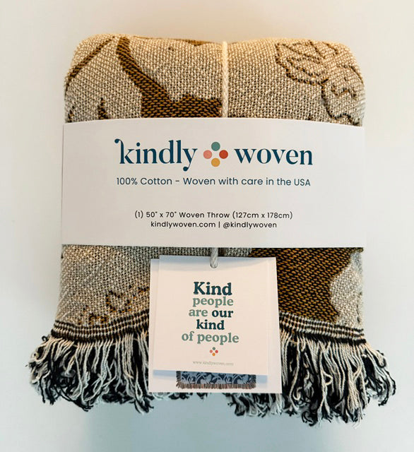 Jacquard throw with cardinal pattern and fringe, with kindly woven fabric tag