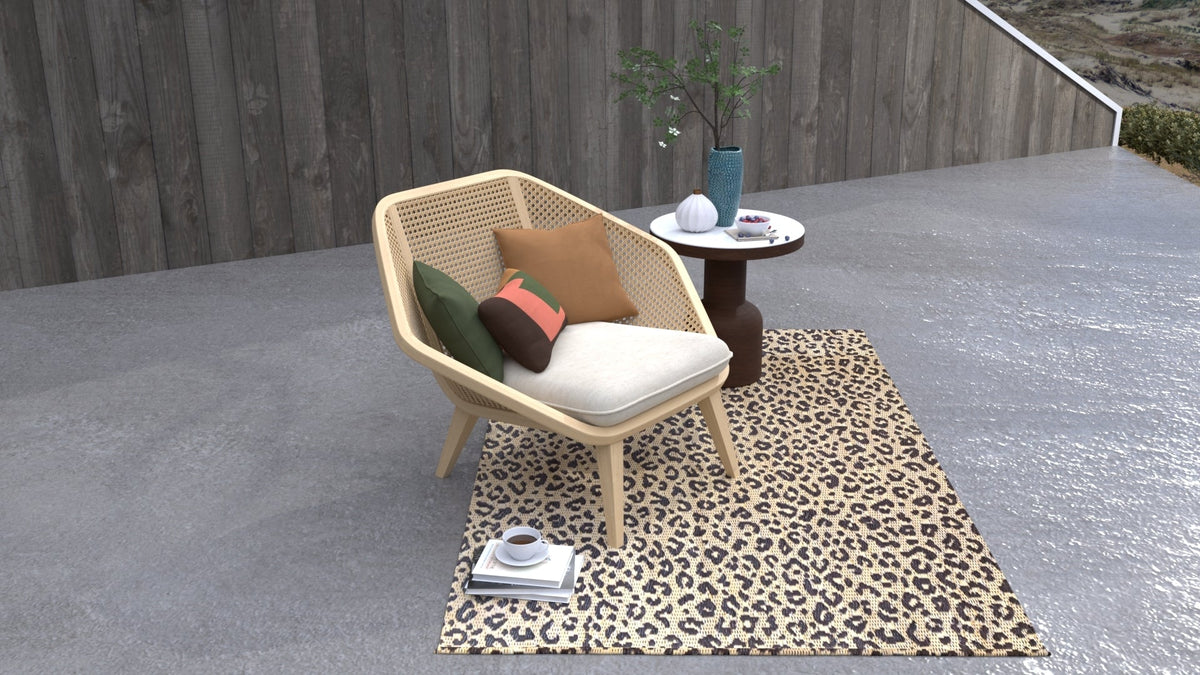 Leopard-print natural area rug with light beige and dark brown spotted pattern