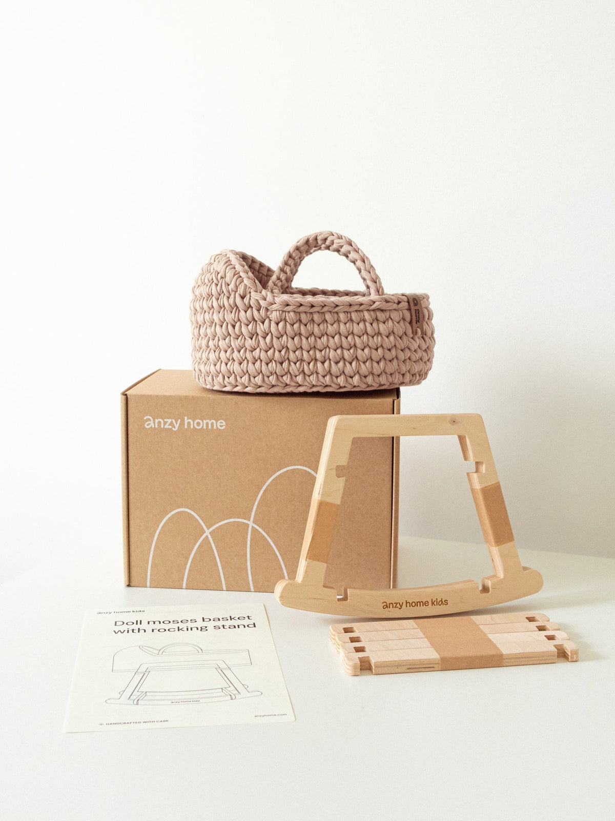 Mini doll moses basket with light beige woven carry handle and wooden rocking stand