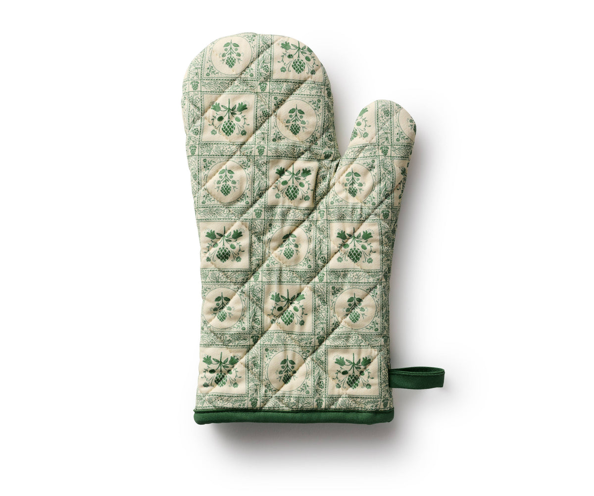 Rifle Paper Co. quilted oven mitt in green and cream artichoke patchwork, with loop