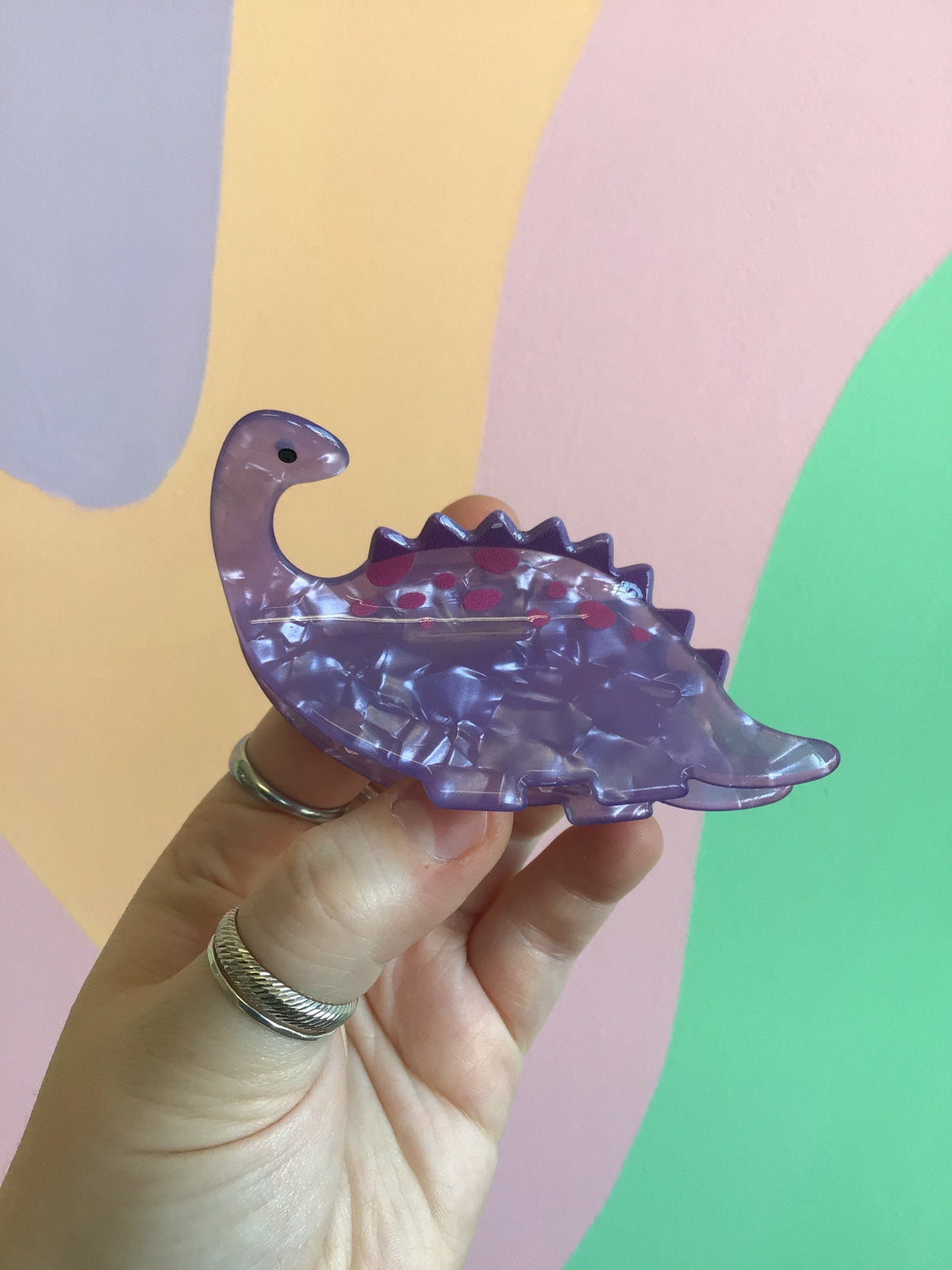 Purple dinosaur hair claw with clear acrylic claws and heartlike pattern