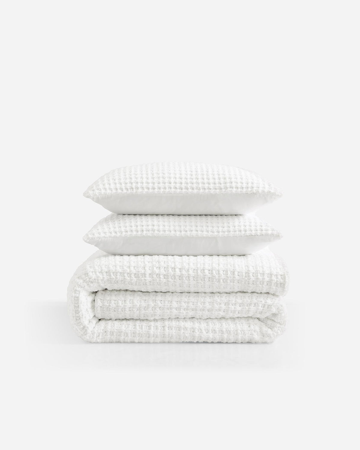 Waffle comforter bundle: folded comforter set with white textured layers