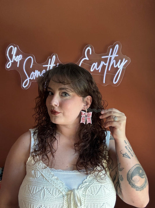 Red gingham bow earrings on gold hoop hardware