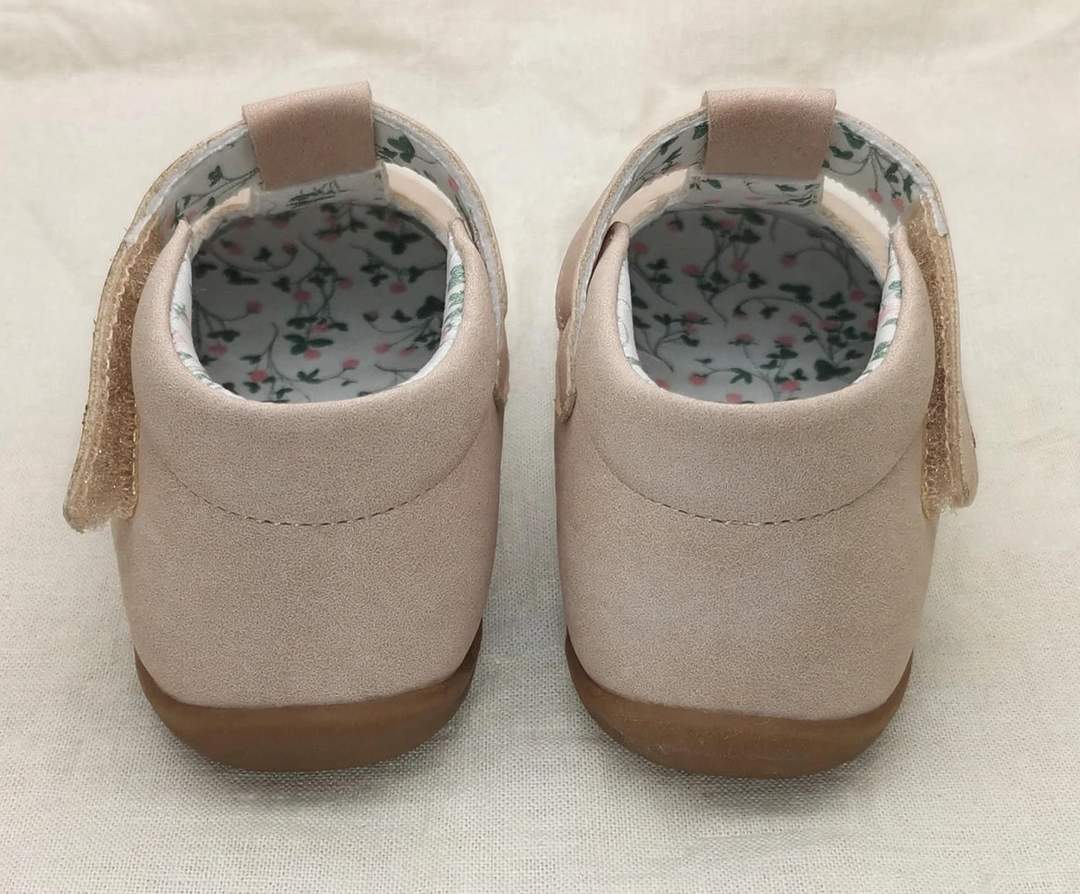 Back view of blush pink kids Mary Jane slip-on shoes with fabric tabs