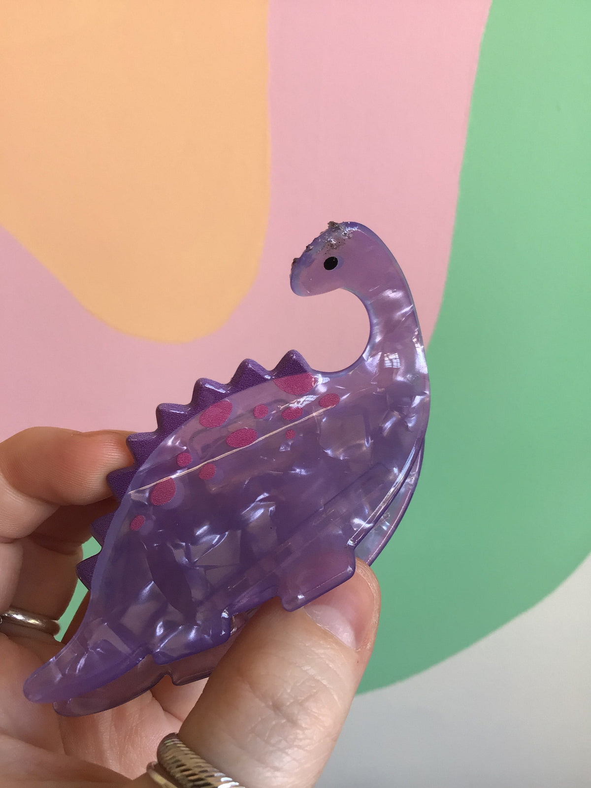 Purple dinosaur hair claw with clear acrylic claws and pink spotted accents