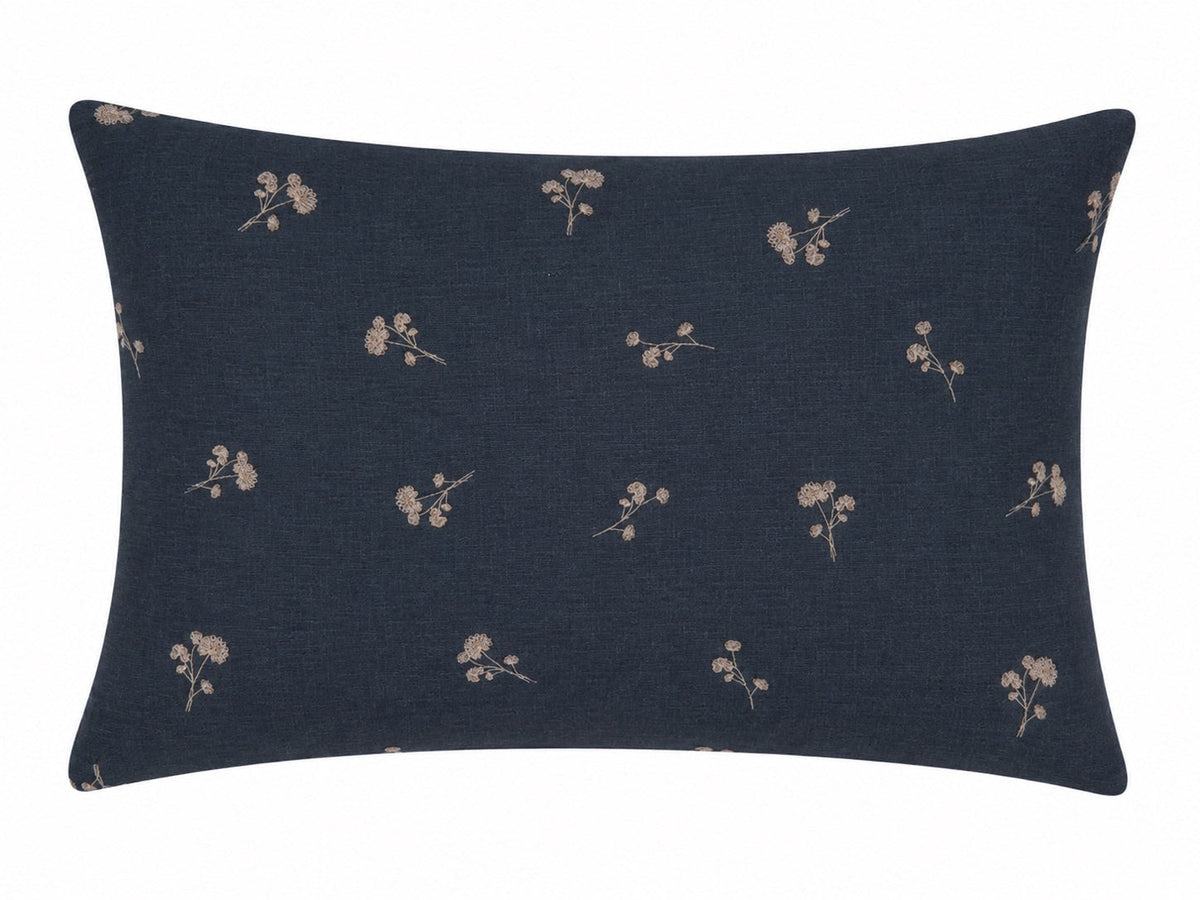 Pillowcase with scattered floral sprigs on a dark navy ground
