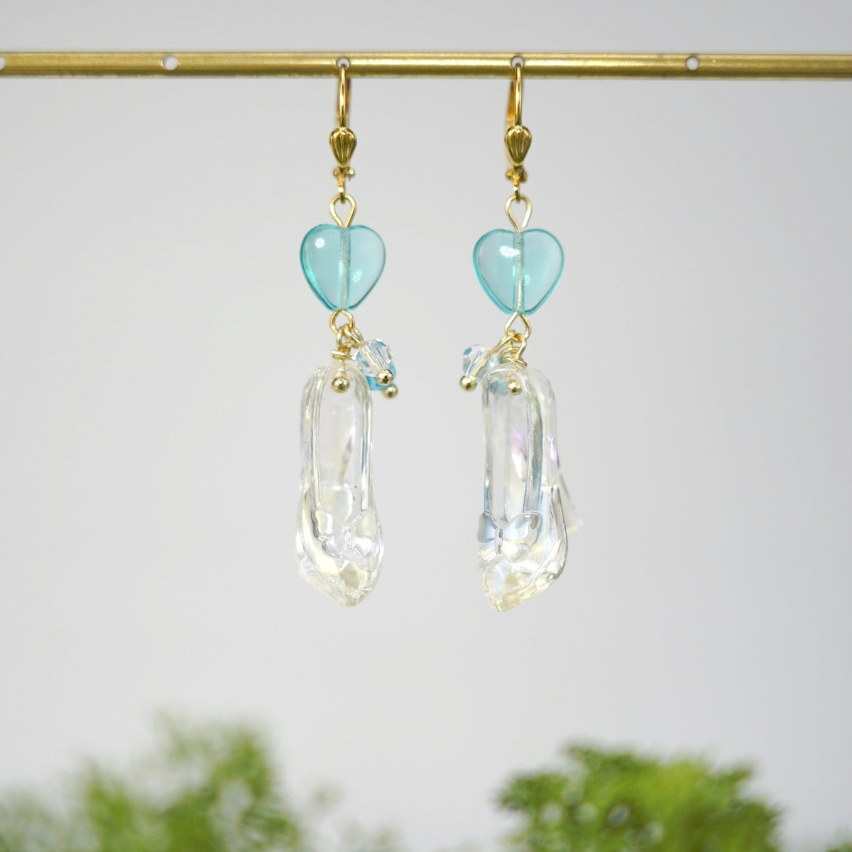Cinderella glass slipper earrings with light blue heart charms and clear dangling slippers