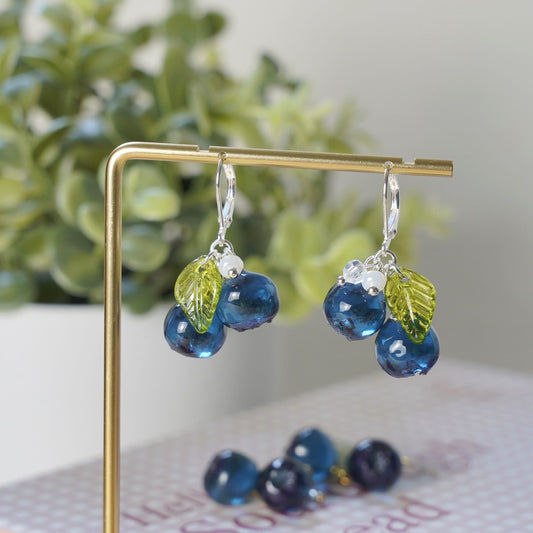 Blueberry resin cluster earrings with blue beads, green leaf charms, silver hook drops