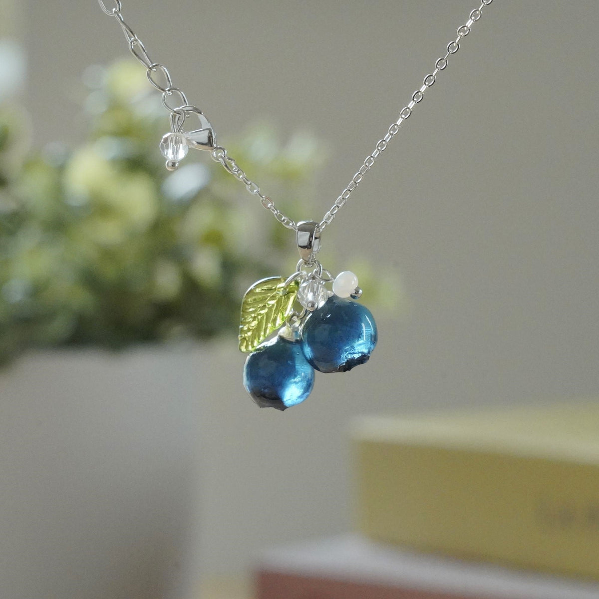 Silver blueberry fruit cluster pendant necklace with resin berries and green leaf charm