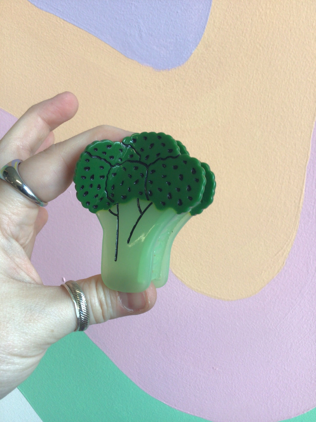 Broccoli-shaped hair claw in dark green with mint-green stem