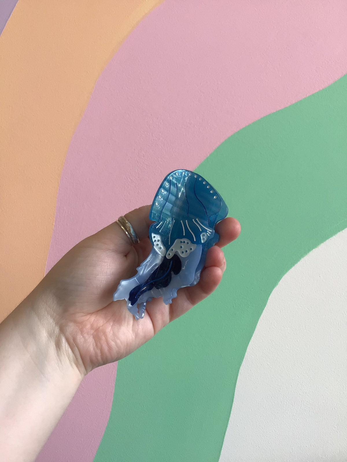 Blue jellyfish hair claw with darker blue base and dotted detailing