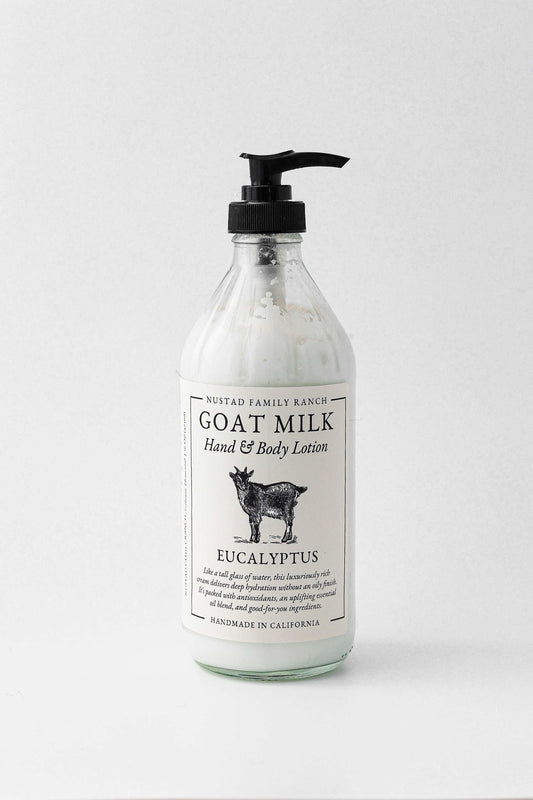 Goat milk body lotion bottle with eucalyptus scent and black pump