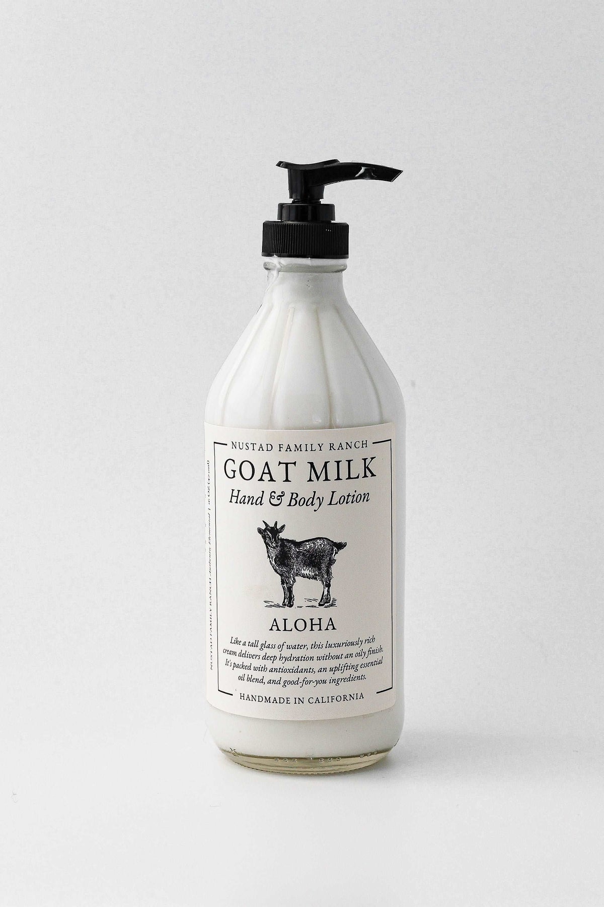Goat milk hand and body lotion bottle with black pump, Aloha label