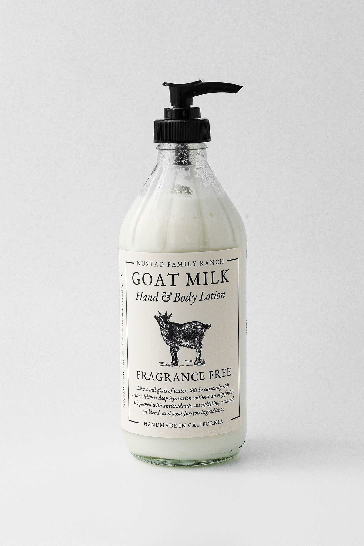 Fragrance-free goat milk hand and body lotion pump bottle, white bottle with black pump