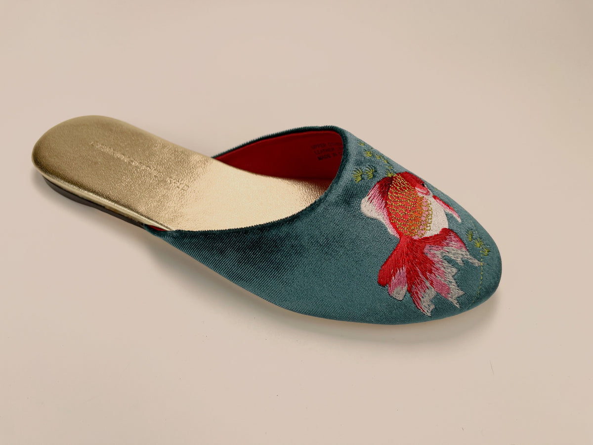 Single teal velvet mule slipper with red goldfish embroidery and beige interior lining