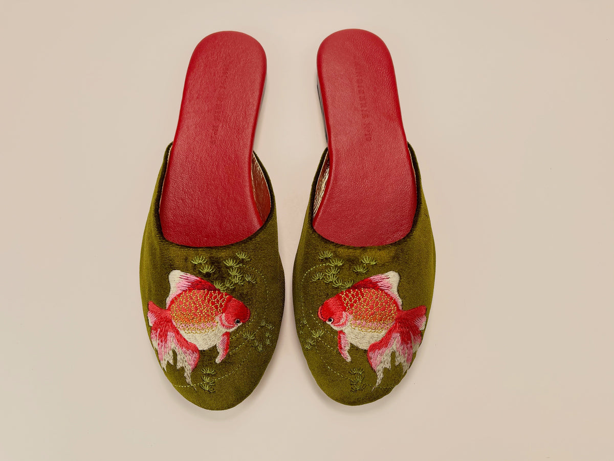 Pair of olive velvet mule slippers with red goldfish embroidery and red insoles