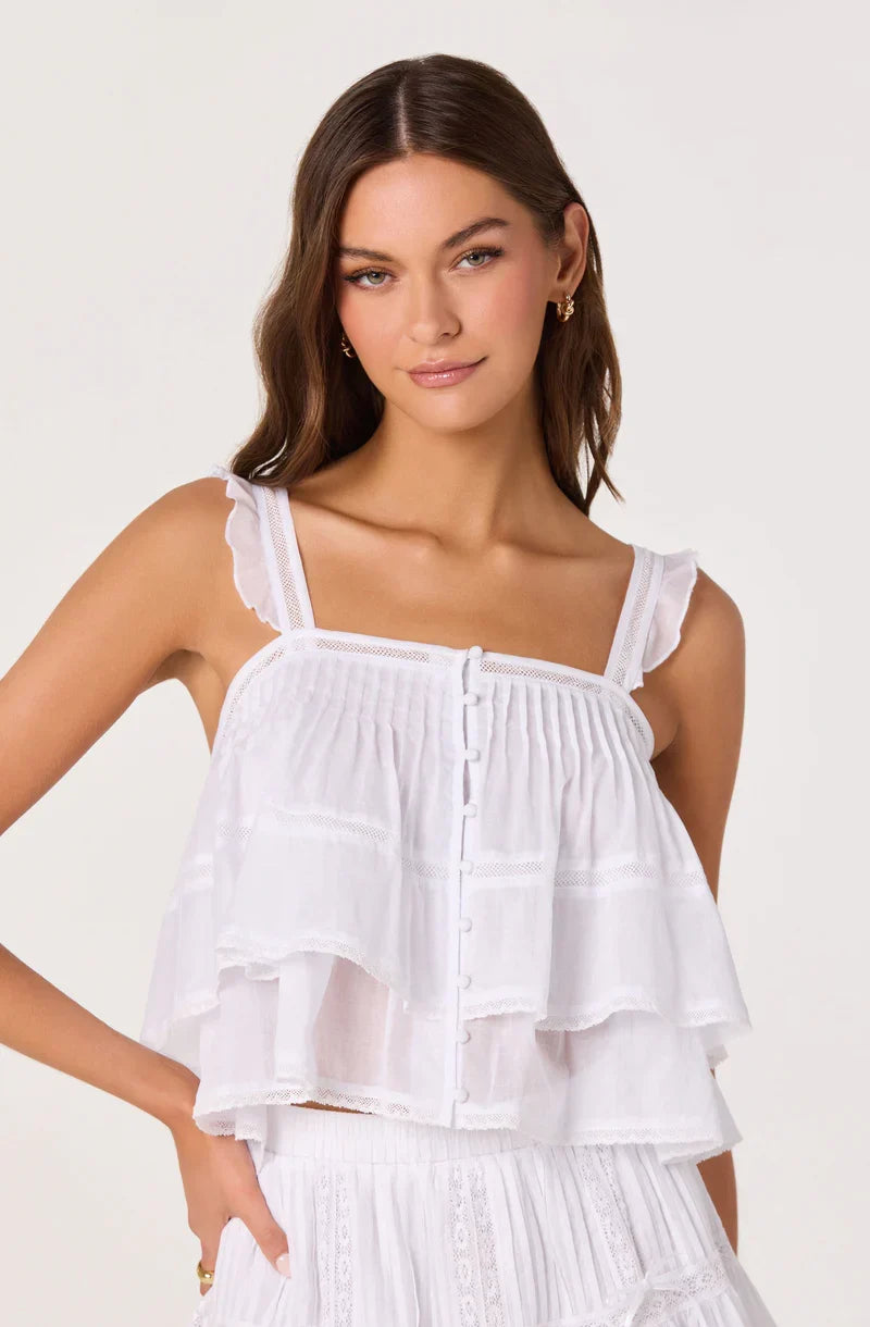 White ruffle babydoll top with smocked bodice and button placket; thin spaghetti straps