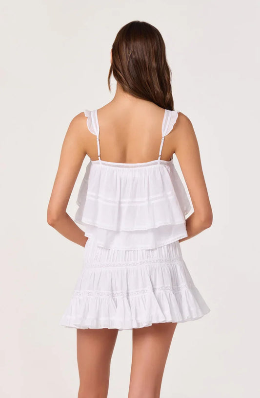 White tiered babydoll top, racer-back straps, smocked bodice, and ruffle skirt hem