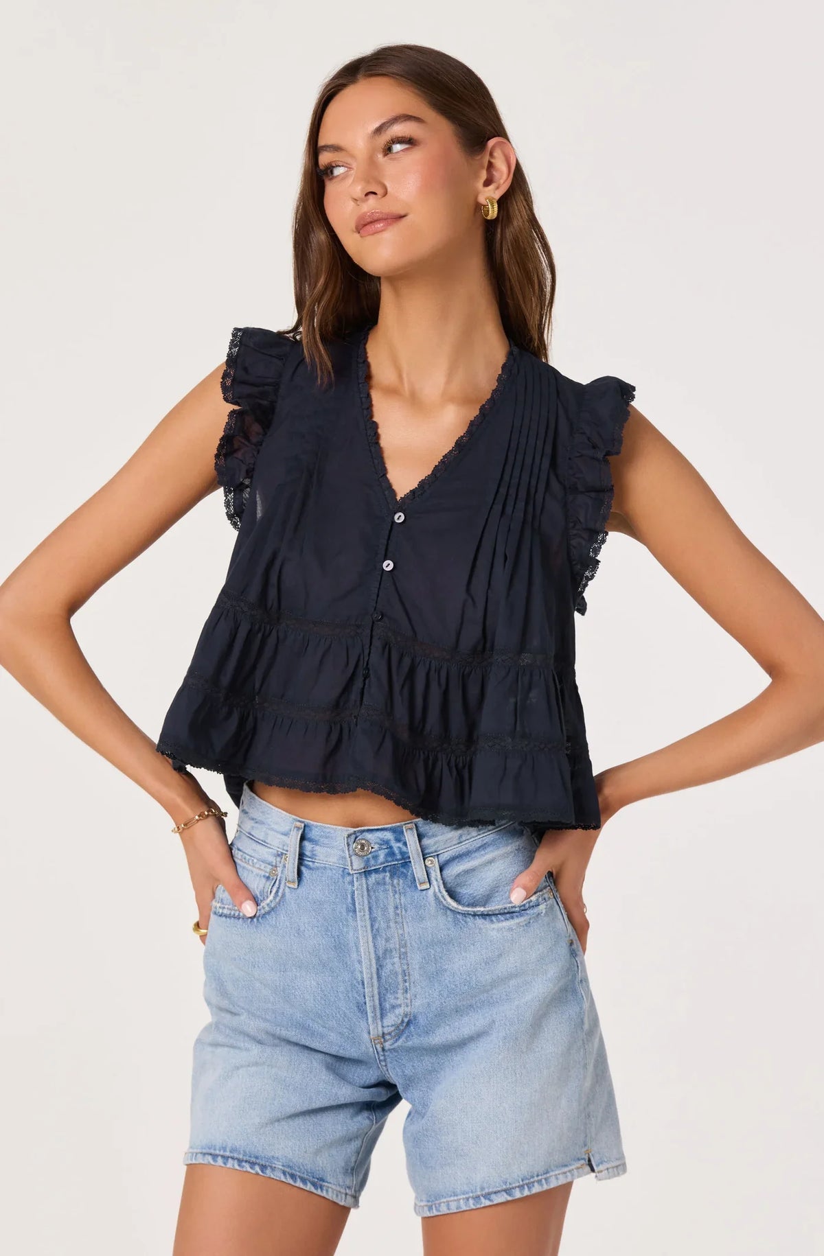Navy ruffle-sleeve sleeveless top with V-neck button front and gathered tiers