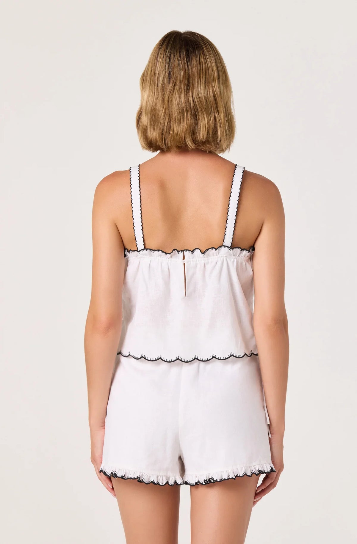 Off-white camisole top back with thin straps and scalloped hem