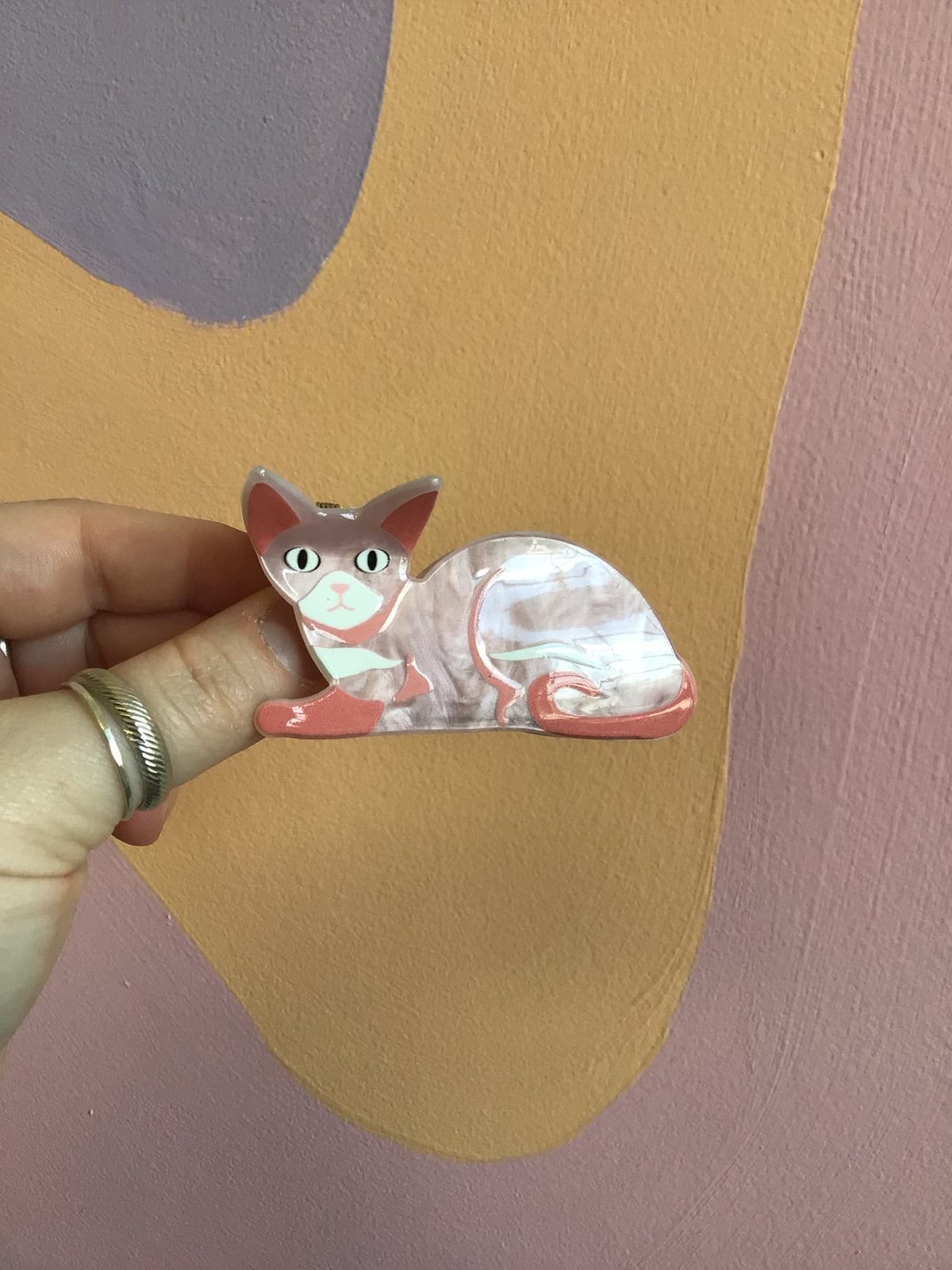 Pink and white cat hair claw clip with cat face and open mouth