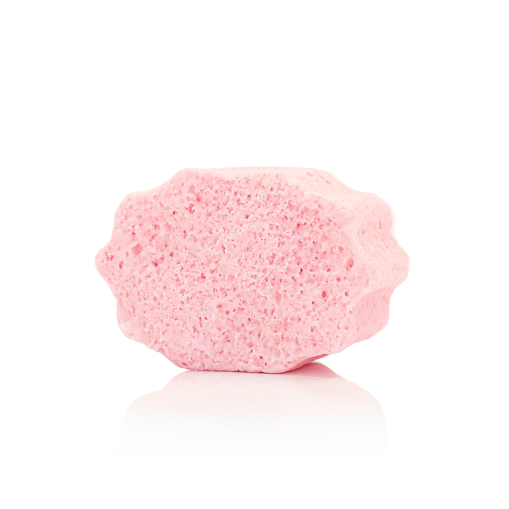 Pink and white foot buffer sponge with rounded textured surface
