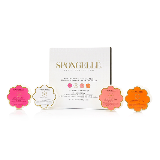 Spongette Quartet gift set with four flower-shaped cleansing sponges in pink, white, coral, orange.