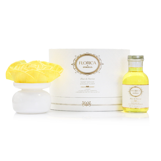 Floral diffuser set with yellow oil bottle, white ceramic floret, and box