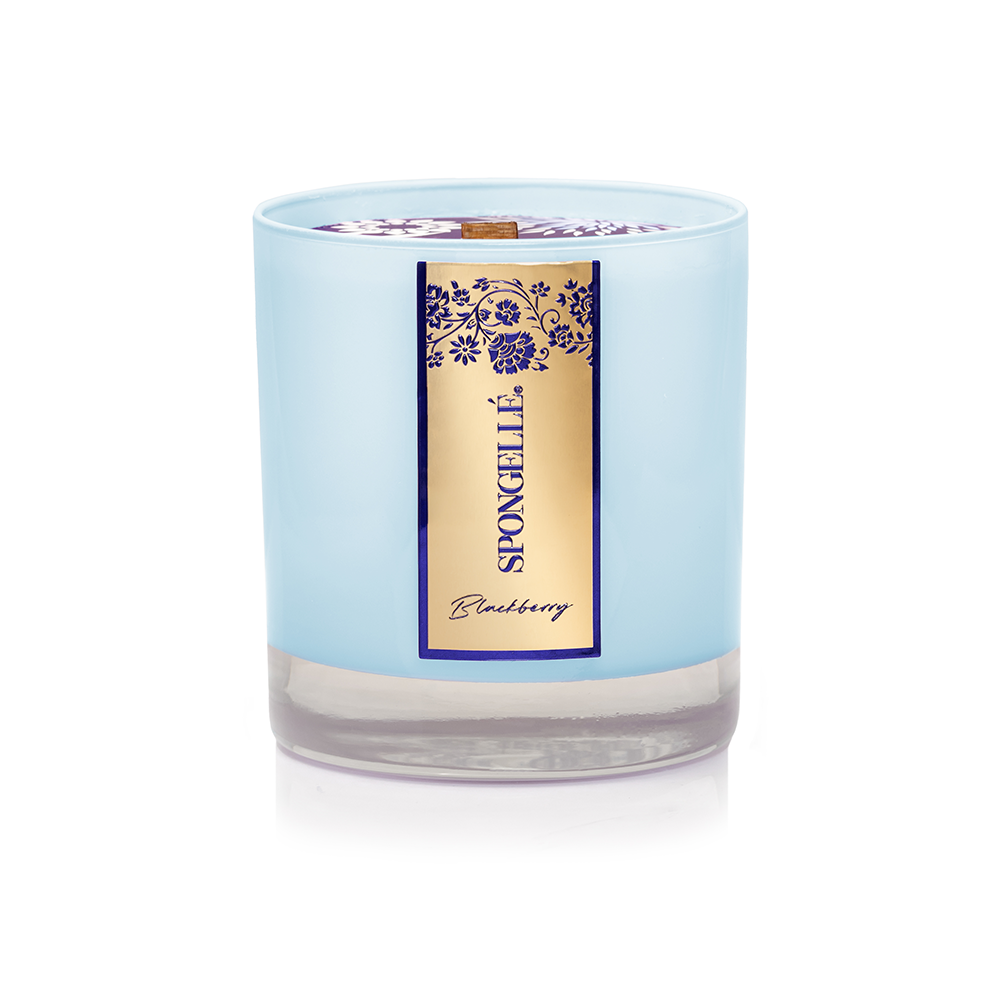 Blue frosted glass candle jar with blackberry label and small center wick