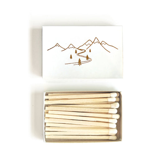 Snowy mountain matchbox with cover and open box filled with wooden matches
