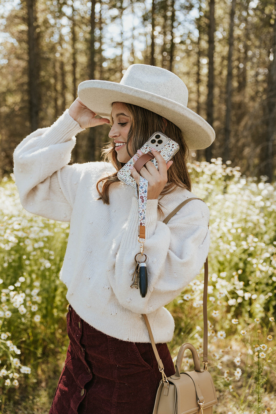 Floral wrist lanyard with tan strap and metal keyring for phone