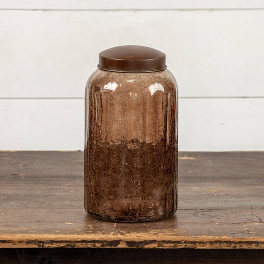 Amber glass jar with antique-style dark brown metal lid, cylindrical