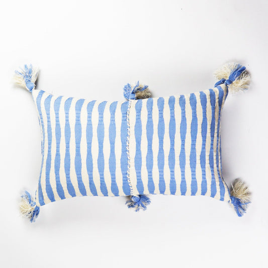 Blue and white striped throw pillow with fringed tassels on corners
