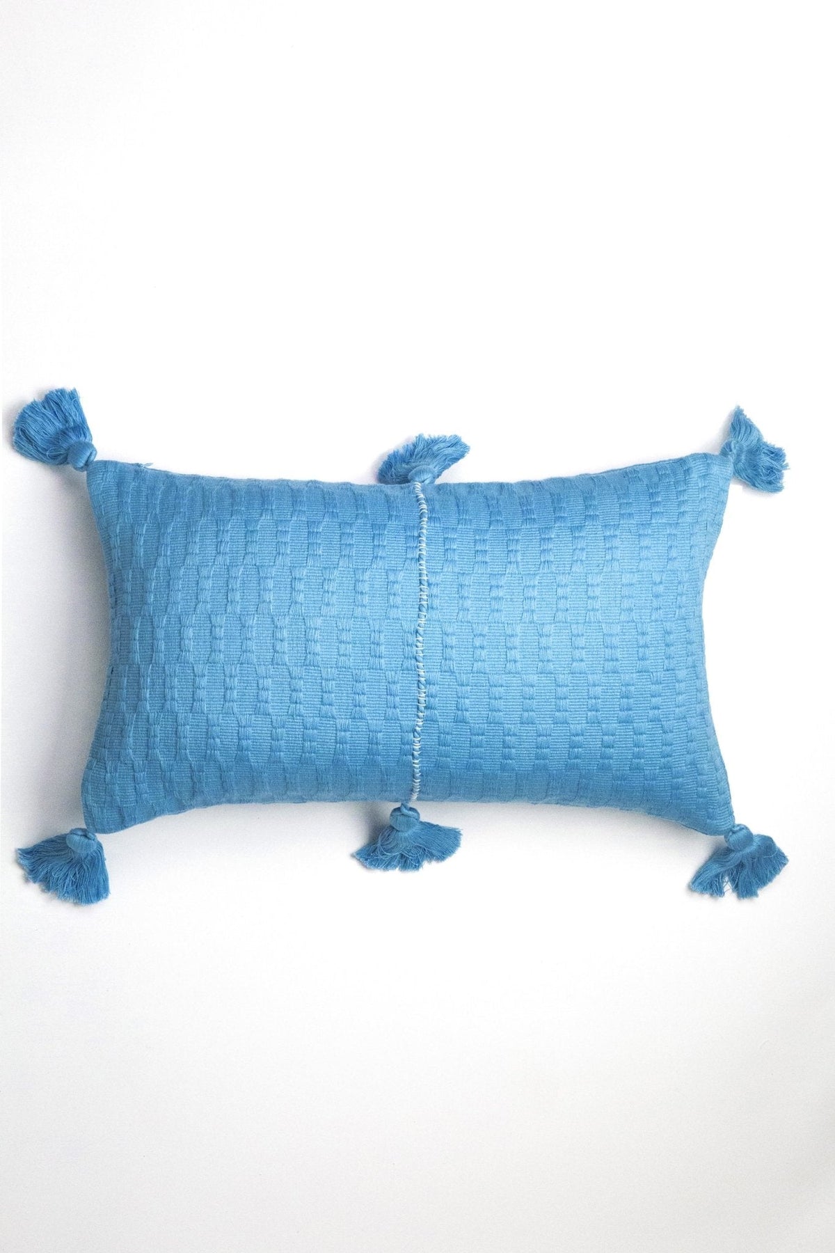 Sky blue solid textured lumbar pillow with corner pom tassels