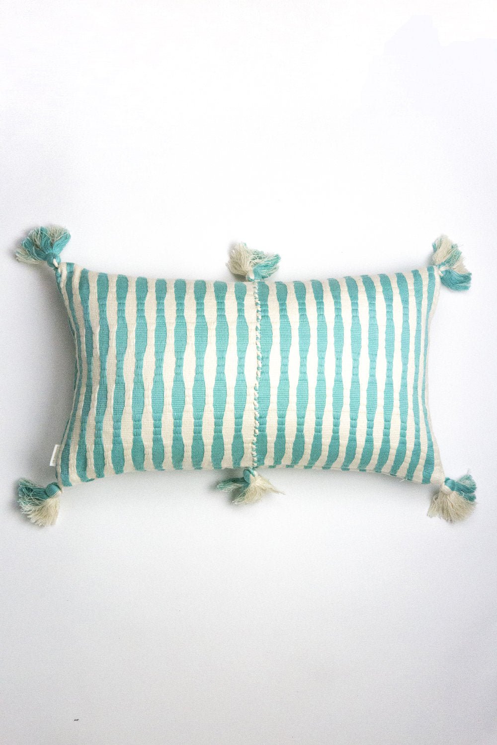 Faded aqua striped rectangular throw pillow with tassel corners and center seam