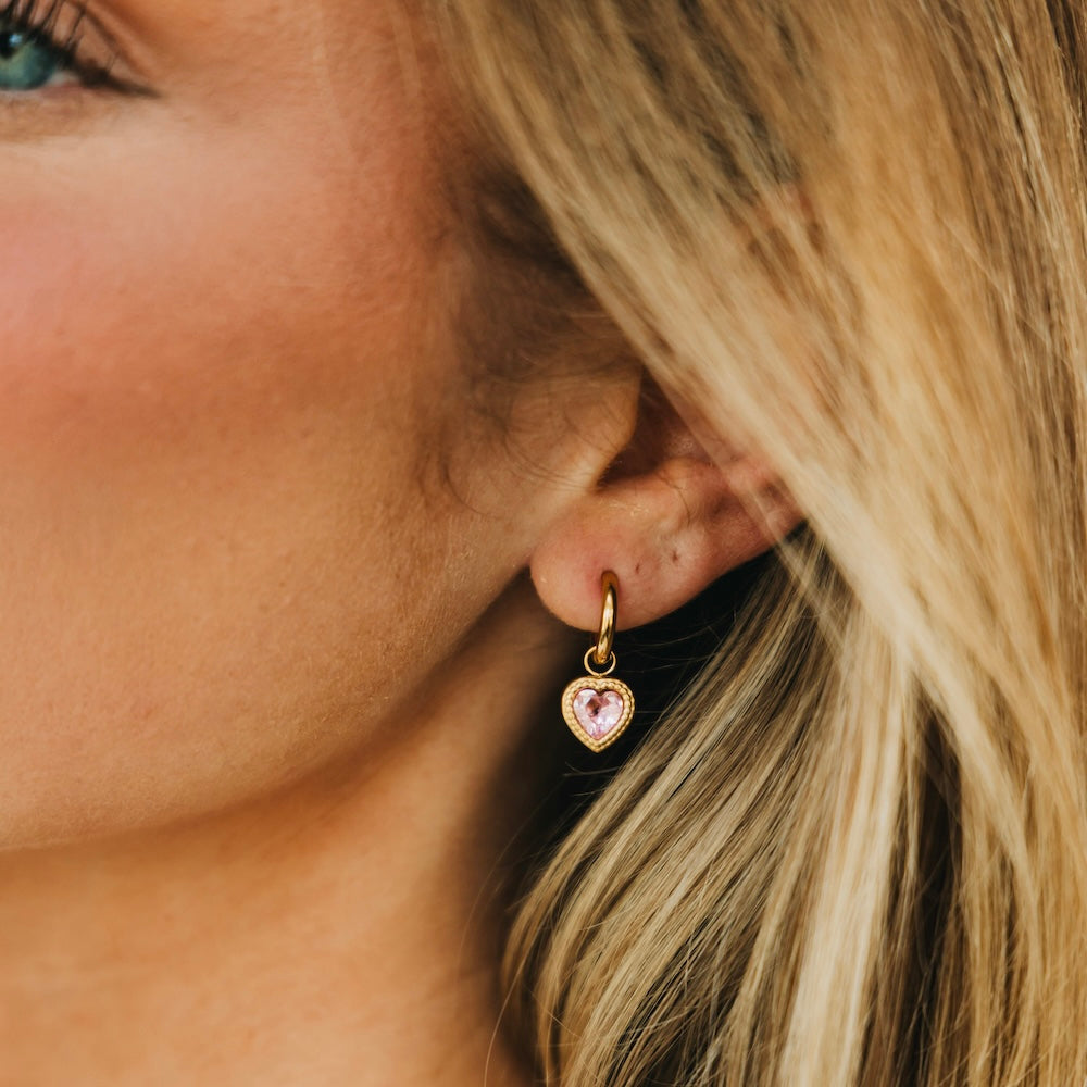 Gold-tone heart dangle earrings with pink heart charm and small hoop