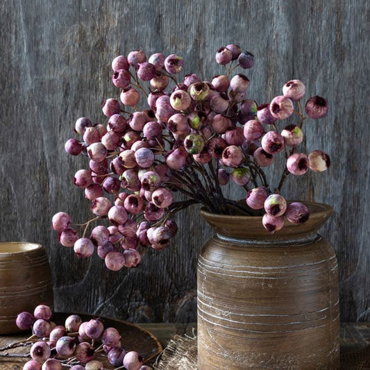 Faux hawthorn berry stem with clusters of purple-pink berries on dark branches